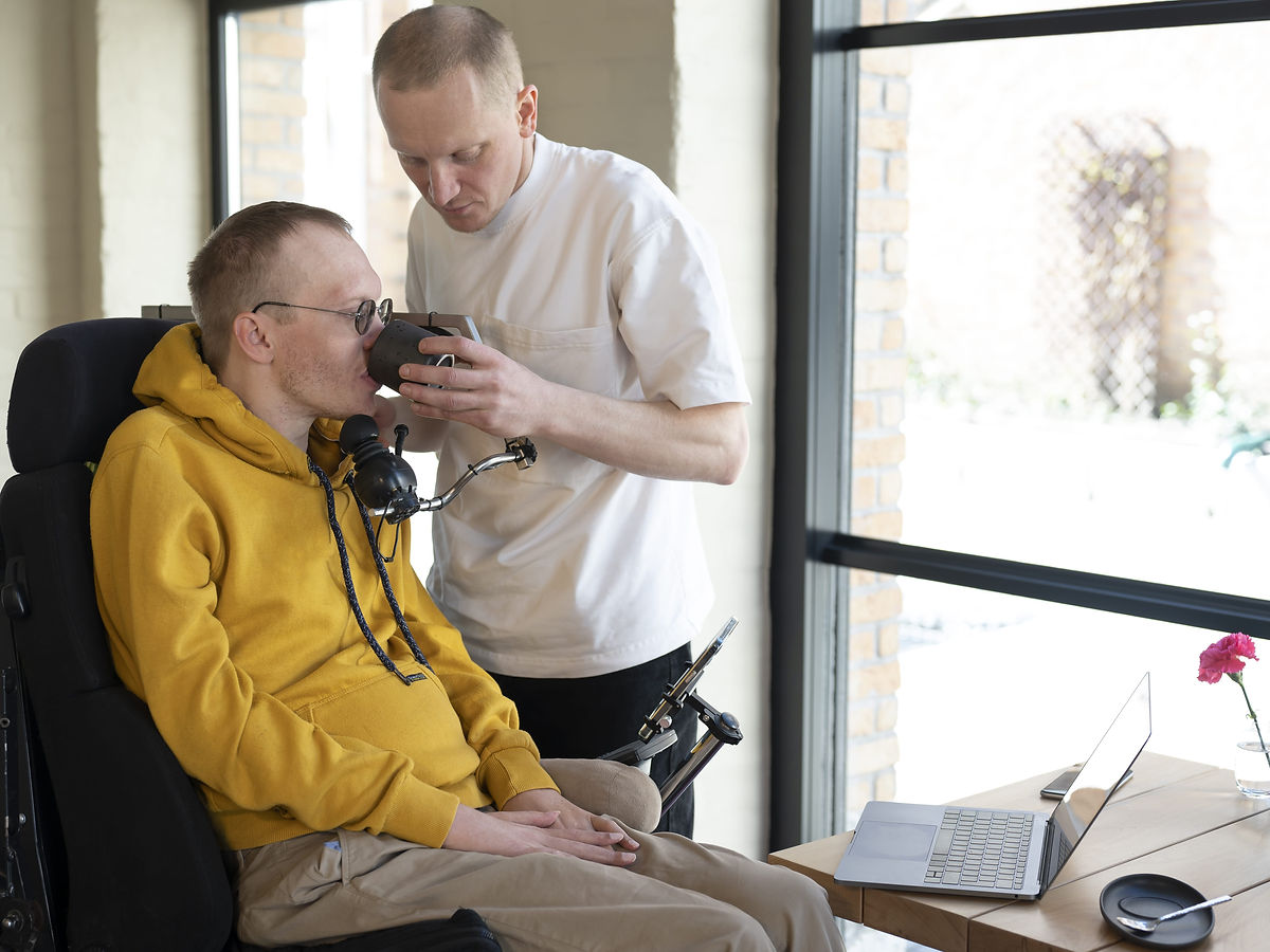 Support worker helping a participant