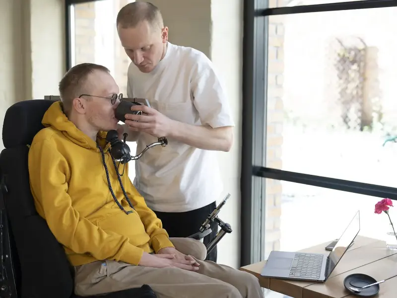 Support worker helping a participant
