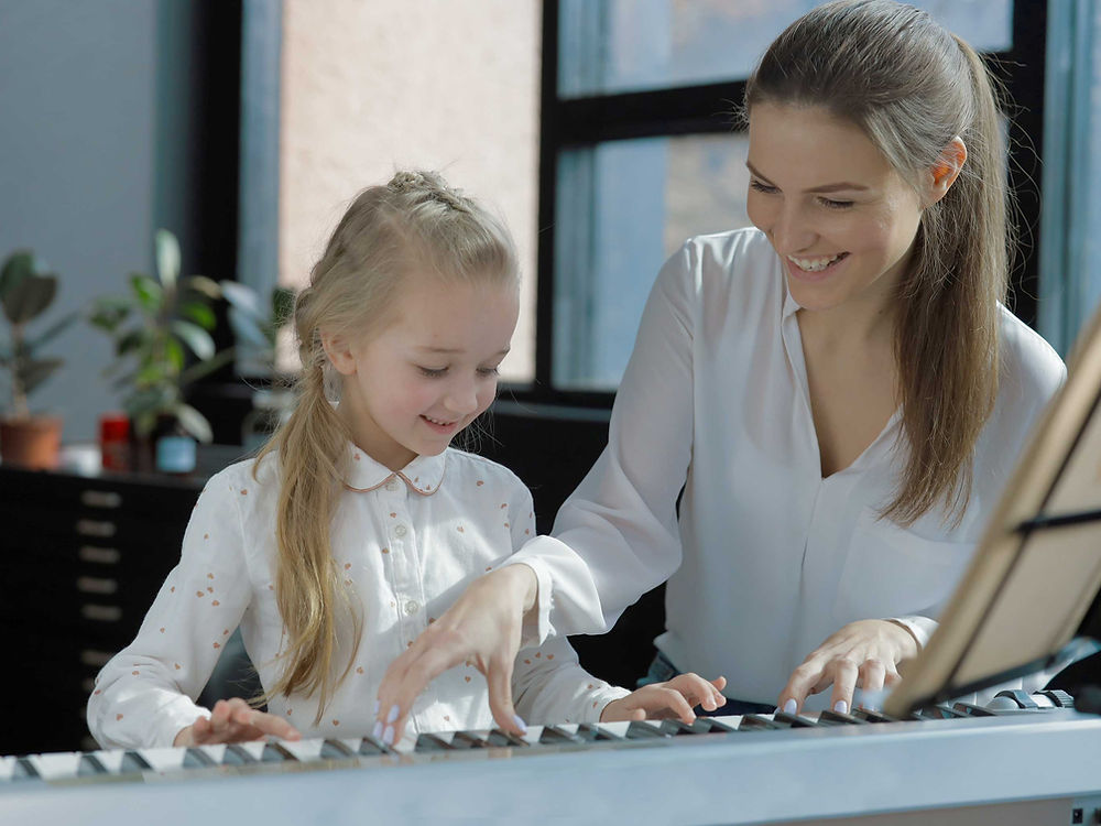 Participant playing piano, engaged in a personal interest